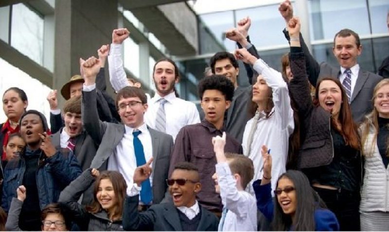 Group of cheering people in suits