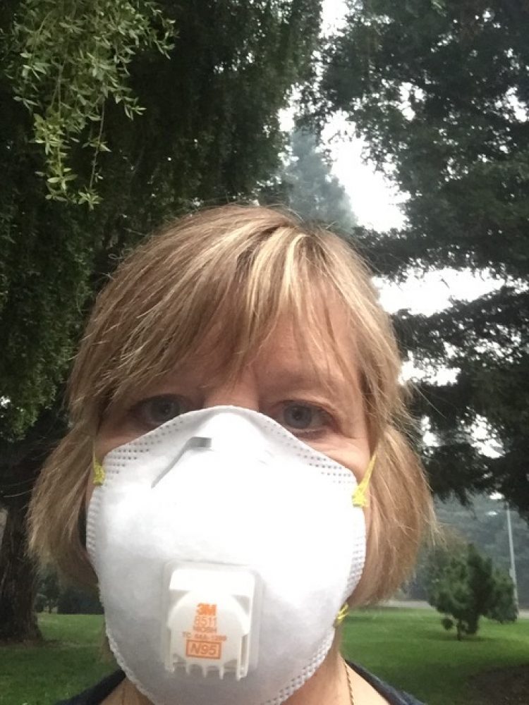 A woman in a N95 face mask