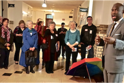 Image: Councilman Derek Green (right),a public banking advocate, addresses local lobbyists at Philadelphia City Hall on Lobby Day (Rita in blue and Pamela in teal). Photo: Stanley Shapiro.