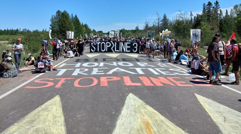 Treaty People Gathering Chalk Sign on Bridge