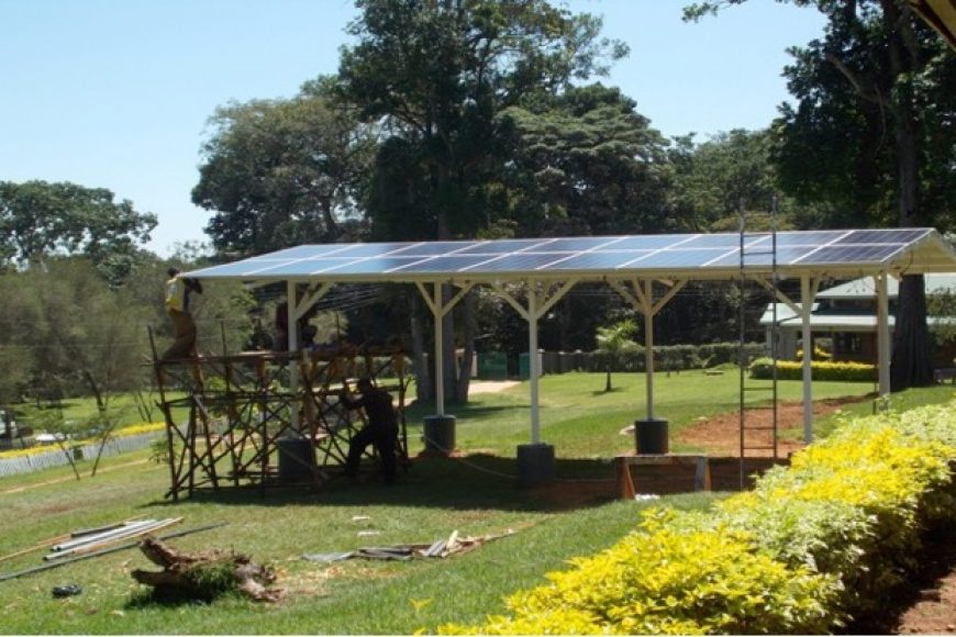 Green lawn with solar panel array