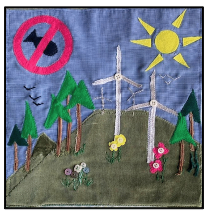 Quilt with wind mills and trees and sun