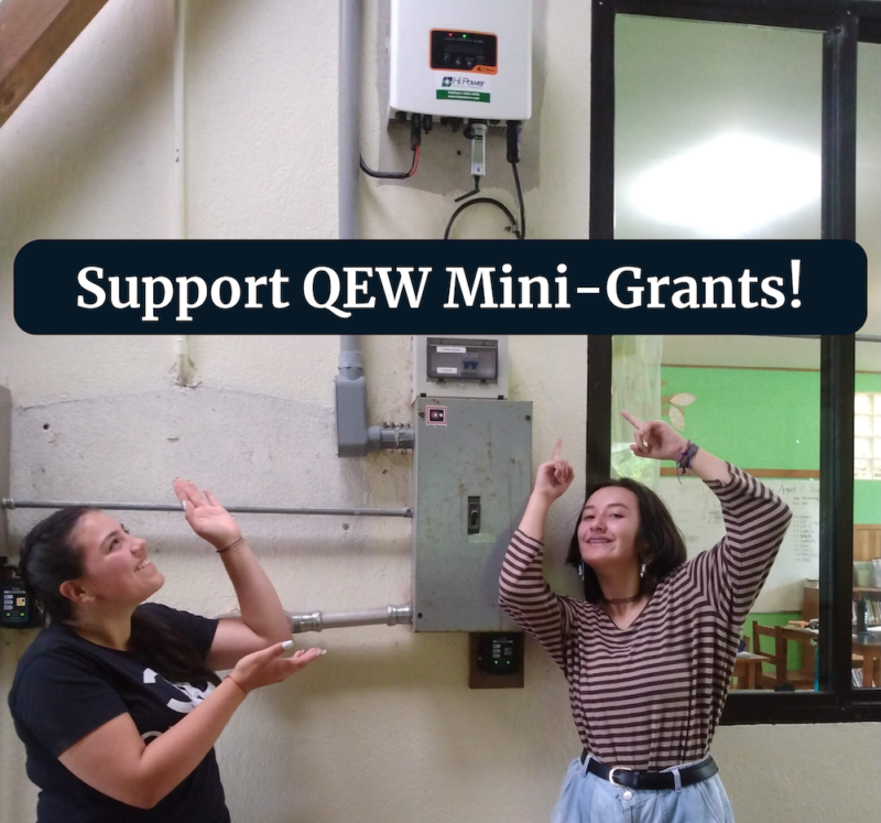 Two teenagers point at solar inverter with text "Support QEW Mini-Grants