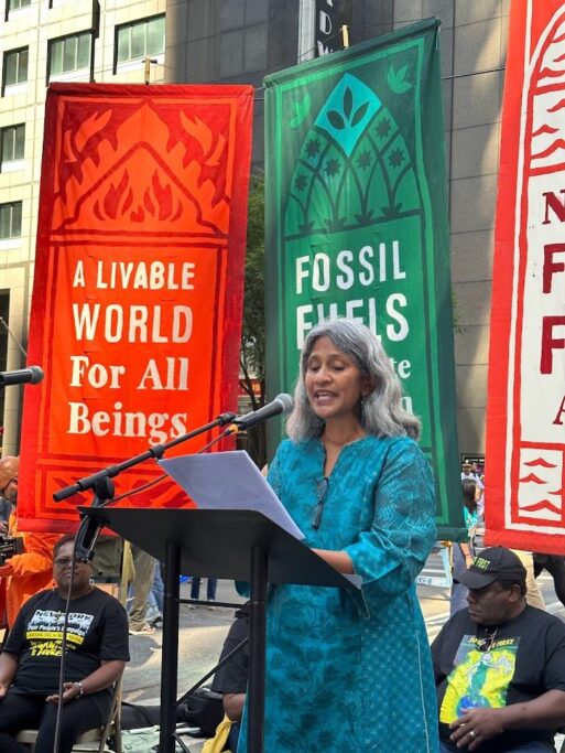 Sunita Viswanath praying at the March to End Fossil Fuels